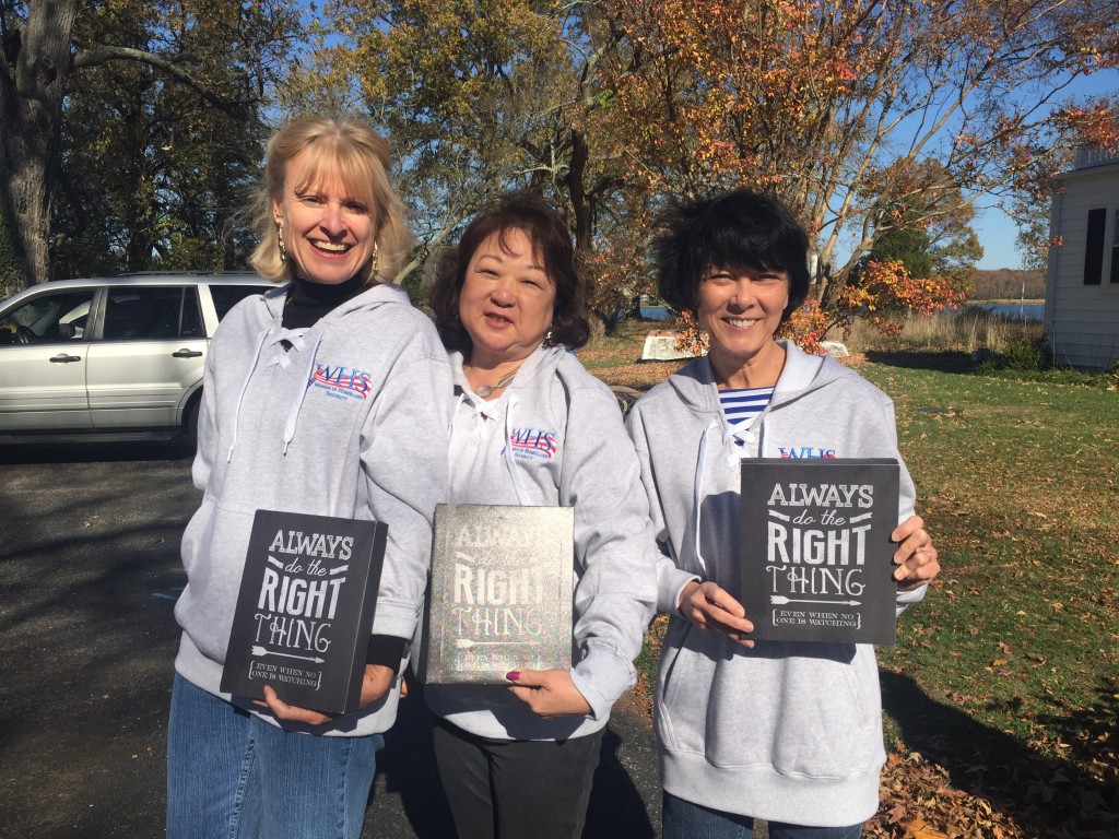 WHS Treasurer Sue Crow, Elena Mitchell, and Sharla Rausch show off their message of inspiration.
